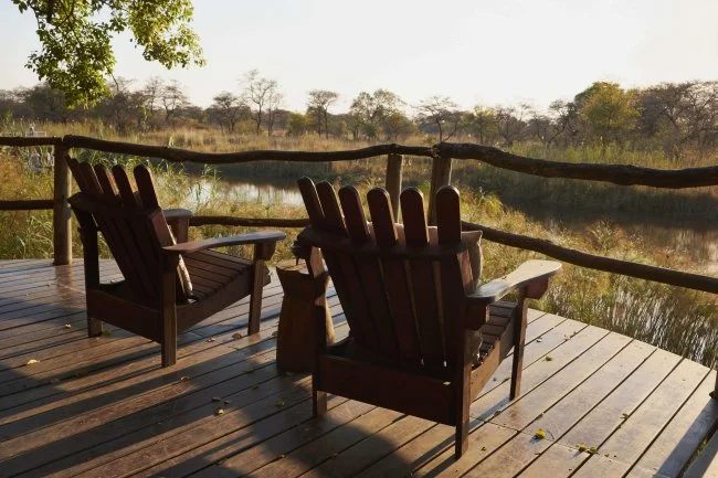 Adirondack Chairs on Deck with River View